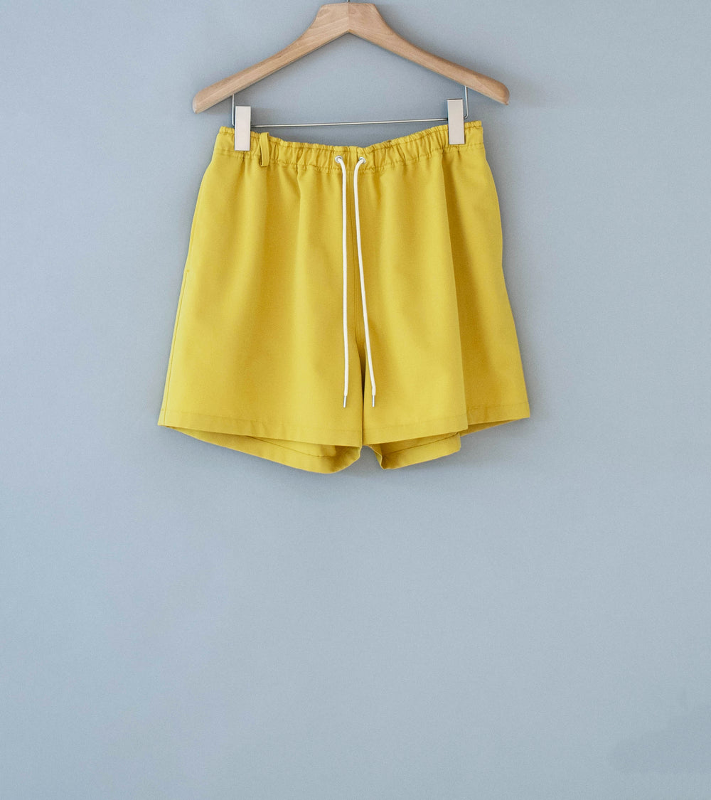 Auralee 'Wool Max Canvas Shorts' (Mustard Yellow)