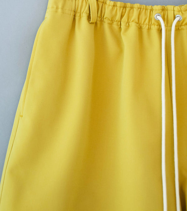 Auralee 'Wool Max Canvas Shorts' (Mustard Yellow)