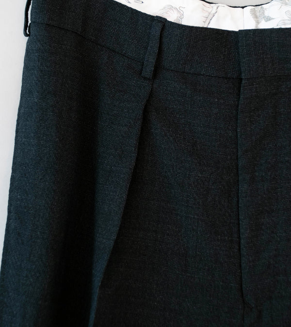 Niceness 'T.SCHENKER Flying V Mélange Herringbone Trousers' (Charcoal)