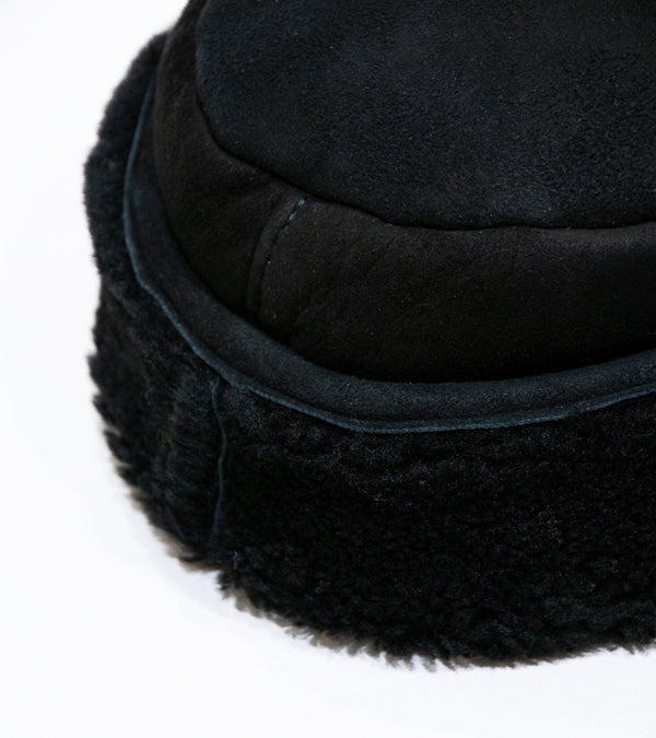 Margaret Howell 'Press Stud Shearling Cap' (Black Curly Merino Shearling)